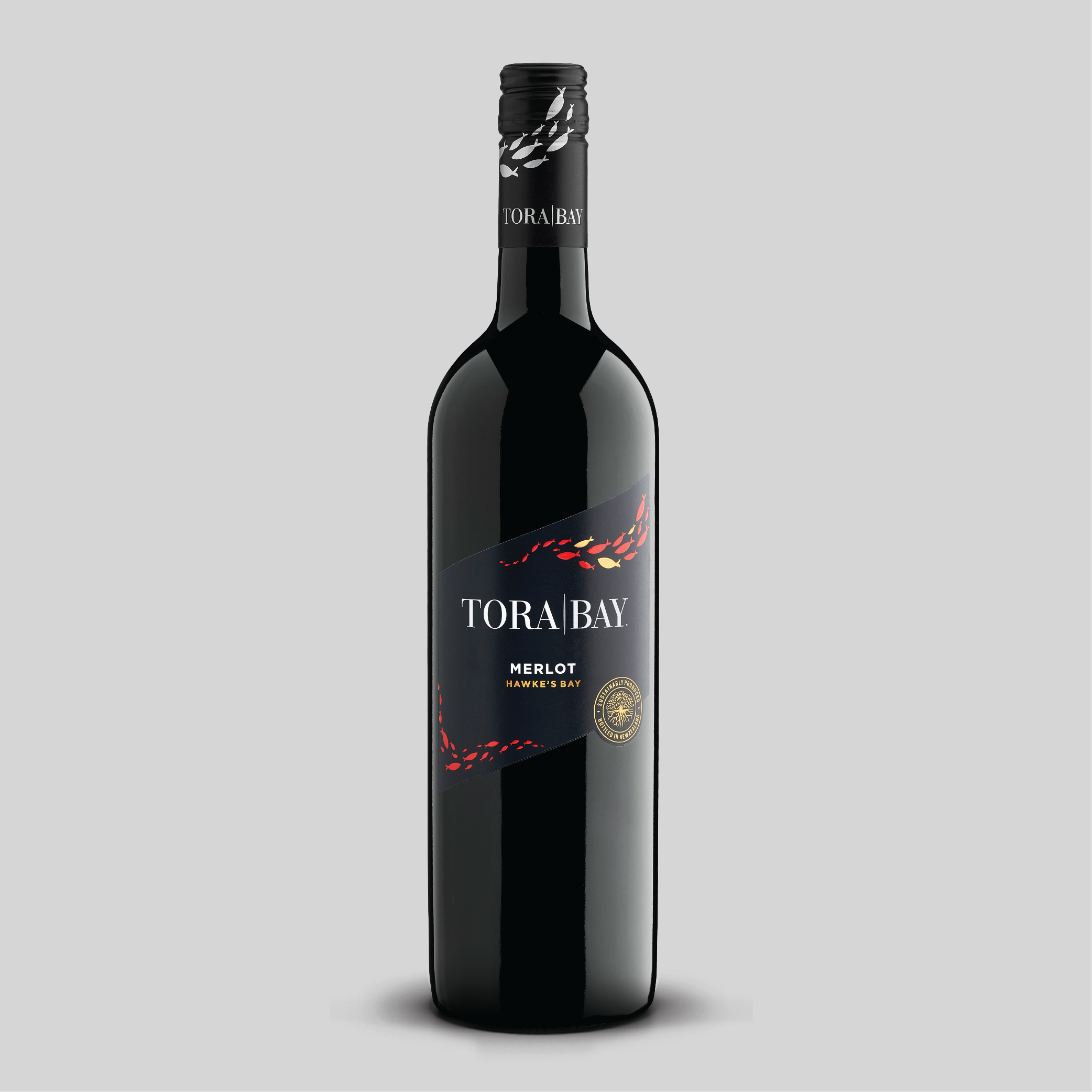 Tora Bay Merlot wine bottle on a gray background